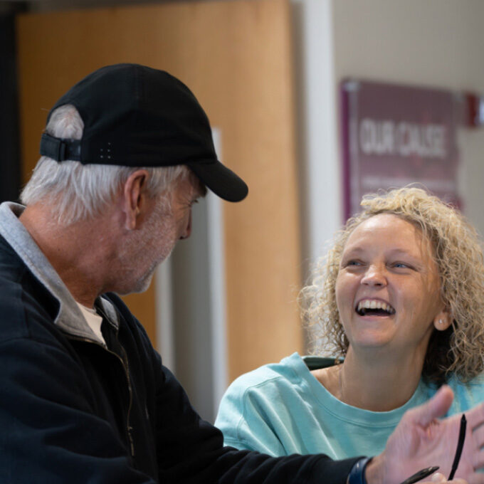 Employee laughing with YMCA guest